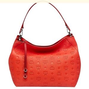 Orange Monogrammed Hobo Leather Klara MCM bag/crossbody 11’in L x 5’ W x 10’H